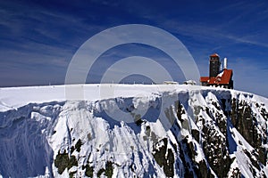 Snow cornice and escarpment in winter in KrkonoÃÂ¡e mountains call photo